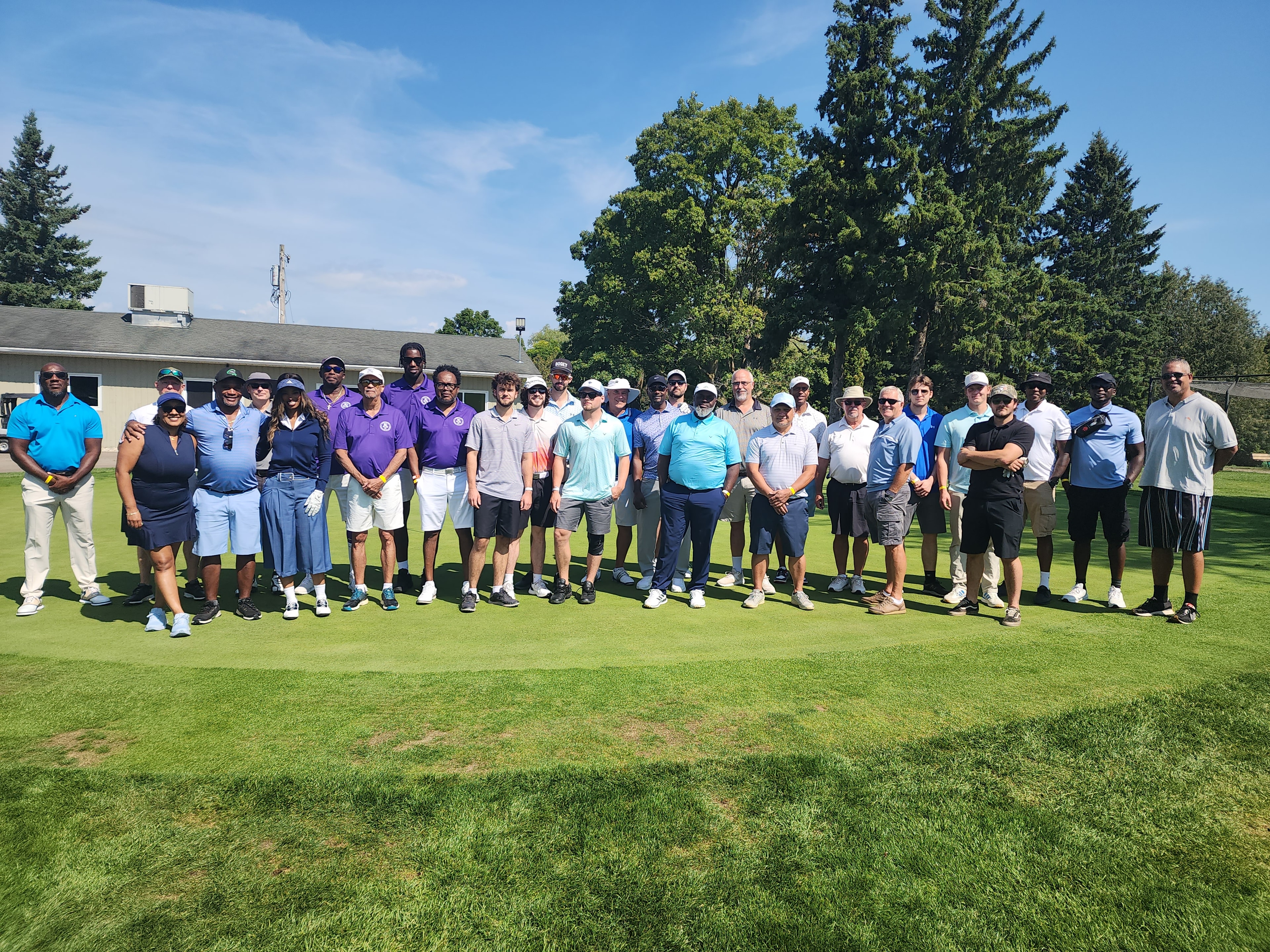 All participants group photo on the golf course